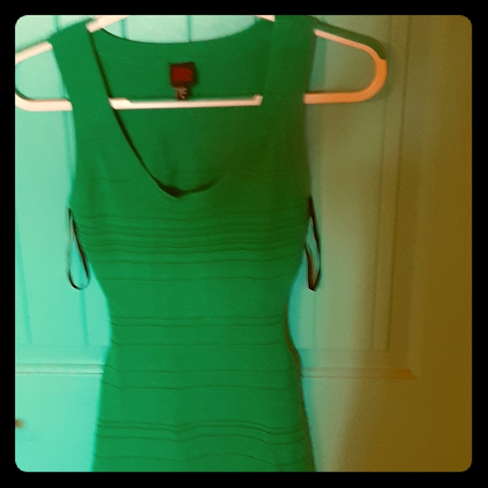 BEBE green open back mini dress